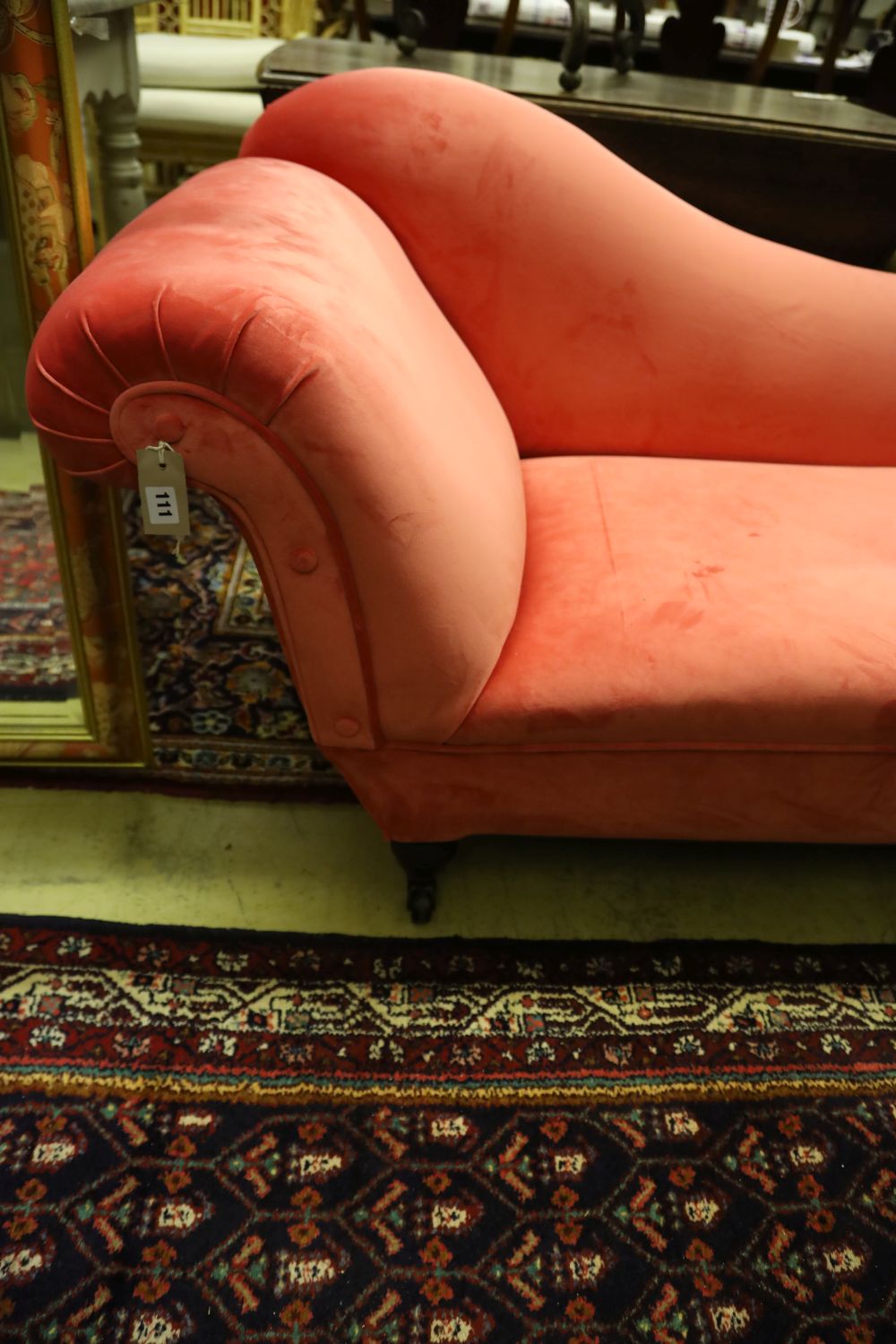 A Victorian chaise longue upholstered in pink velvet, width 180cm, depth 66cm, height 74cm